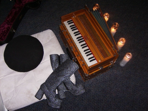Mantra-Pop Still Life by Robin Renee 2006 (harmonium, candles, meditation cushion, and boots)